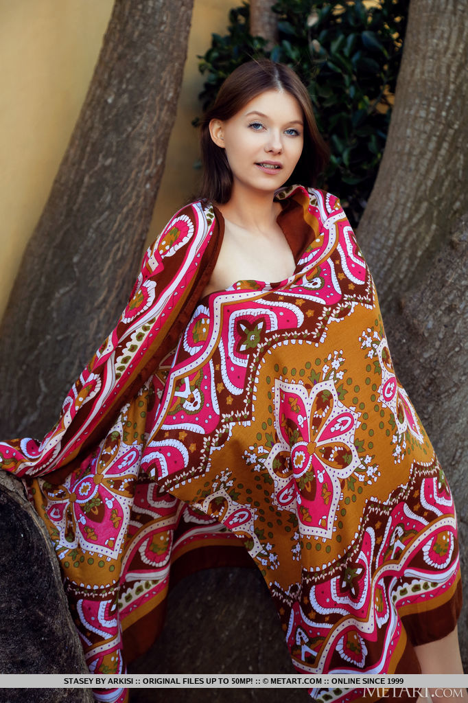 Stasey discards her huge printed shawl climbs a